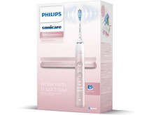 Charger l&#39;image dans la galerie, Brosse à dents Philips Sonicare rose avec boîte, avec une présentation promotionnelle.
