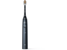 Charger l&#39;image dans la galerie, Une brosse à dents électrique sur fond blanc. Elle est gris foncé avec une tête noire.
