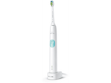 Charger l&#39;image dans la galerie, Brosse à dents électrique blanche sur chargeur. Soies vertes, bouton bleu, fond blanc.
