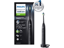 Charger l&#39;image dans la galerie, Brosse à dents électrique Philips Sonicare noire. L&#39;image montre la brosse et son chargeur. L&#39;emballage est visible.
