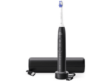 Charger l&#39;image dans la galerie, Une brosse à dents électrique noire avec une base de chargement et un câble USB.
