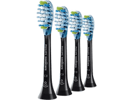 Quatre têtes de brosse à dents Philips Sonicare noires avec des poils bleus et blancs sur fond noir.