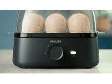 Charger l&#39;image dans la galerie, Cuiseur d&#39;œufs noir avec 3 œufs à l&#39;intérieur du couvercle transparent.
