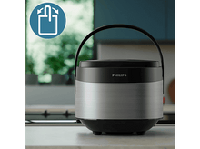 Charger l&#39;image dans la galerie, Un récipient alimentaire Philips noir et argenté avec une poignée. Arrière-plan flou.
