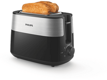 Charger l&#39;image dans la galerie, Un grille-pain noir et argenté avec deux tranches de pain grillé à l&#39;intérieur, sur une surface blanche.
