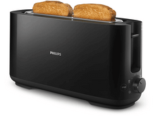 Charger l&#39;image dans la galerie, Grille-pain Philips noir avec deux tranches de pain grillé à l&#39;intérieur, sur une surface blanche.
