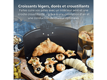 Charger l'image dans la galerie, Un croissant et de petits produits de boulangerie sur un grill. Olives, noix et fromage en arrière-plan, avec un récipient métallique.
