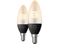 Deux ampoules Philips Hue blanches en forme de bougie avec un filament en spirale, base noire et argentée.