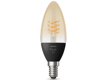 Charger l'image dans la galerie, Une ampoule Philips Hue en forme de bougie avec filament en spirale, base noire et vis argentée.
