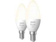 Deux ampoules blanches Philips Hue avec une lueur chaude.