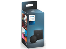 Charger l&#39;image dans la galerie, Boîte d&#39;accessoires Philips Hue. Elle montre un commutateur rotatif noir et un composant carré noir.
