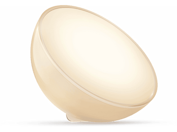 Lampe blanche en forme d'œuf avec un centre lumineux. Elle repose sur une base blanche.