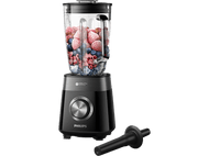 Blender noir et argenté avec un récipient en verre rempli de baies et de fruits.