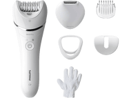 Un épilateur Philips blanc avec plusieurs accessoires et un gant blanc sur une surface noire.