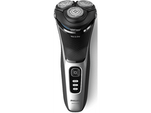 Charger l&#39;image dans la galerie, Un rasoir électrique noir et argent avec trois têtes rotatives. La marque est Philips.
