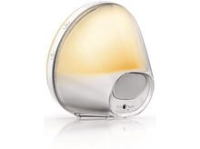 Charger l&#39;image dans la galerie, Un réveil blanc et argenté avec une lumière vive et brillante qui en émane.
