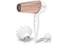 Charger l&#39;image dans la galerie, Un sèche-cheveux blanc et or rose avec des accessoires. Isolé sur fond blanc.
