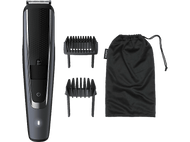 Une tondeuse Philips gris foncé avec accessoires : deux peignes et une pochette noire à cordon. La tondeuse est à gauche.