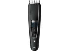 Charger l'image dans la galerie, Tondeuse à barbe électrique noire avec affichage numérique et réglages ajustables.

