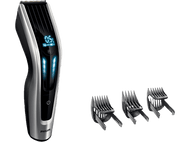 Une tondeuse à cheveux Philips avec un affichage numérique et trois sabots. La tondeuse est argentée et noire.