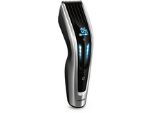 Charger l'image dans la galerie, Gros plan sur une tondeuse à cheveux au design noir et argent.
