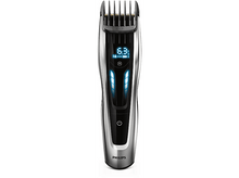 Charger l'image dans la galerie, Tondeuse à cheveux Philips, argent et noir, avec affichage numérique et témoins lumineux bleus.
