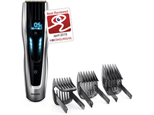 Charger l'image dans la galerie, Tondeuse à cheveux argentée et noire avec trois accessoires et un badge 'Meilleur avis'.
