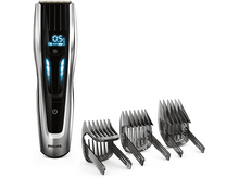 Charger l'image dans la galerie, Tondeuse à cheveux Philips avec trois peignes. La tondeuse a un affichage numérique. Design argent et noir.
