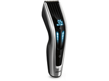 Charger l'image dans la galerie, Une tondeuse à cheveux électrique noire et argentée, avec un écran LCD.
