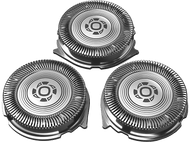 Trois têtes de rasoir argentées. Elles sont circulaires avec un motif interne et une grille métallique externe.