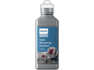 Bouteille de détachant Philips, avec une tache sur un canapé. Le texte dit 'Stain Removing Solution'.