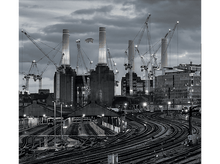 Charger l&#39;image dans la galerie, Pochette d&#39;album: Un paysage urbain avec des usines, un cochon rose dans le ciel et des grues. Ciel sombre et dramatique.
