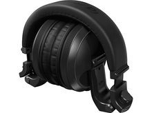 Charger l&#39;image dans la galerie, Casque circum-auriculaire noir. Conception fermée avec oreillettes et bandeau visibles.
