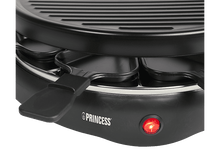 Charger l&#39;image dans la galerie, Un grill à raclette noir avec des poêlons à fromage, avec un indicateur rouge allumé.
