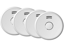 Charger l&#39;image dans la galerie, Quatre détecteurs de fumée blancs, ronds avec des évents noirs. Serrés sur un fond blanc.
