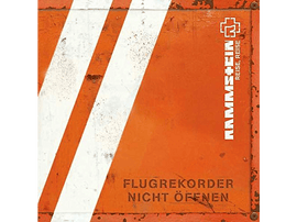 Une surface métallique orange avec des rayures blanches et du texte. Le texte est en allemand et dit 