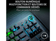 Charger l&#39;image dans la galerie, Gros plan sur les touches d&#39;un clavier gaming. Touches éclairées avec lueur bleue et verte.
