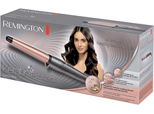 Charger l&#39;image dans la galerie, Une boîte de fer à friser Remington Keratin Protect. Elle présente une femme aux cheveux bouclés, le fer à friser et les détails du produit.
