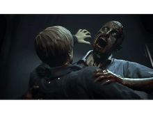 Charger l&#39;image dans la galerie, Un zombie attaque une personne dans une pièce faiblement éclairée. Les deux personnages sont au premier plan.
