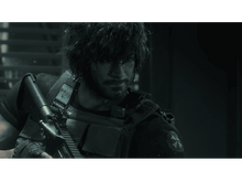 Charger l&#39;image dans la galerie, Un homme aux cheveux noirs courts et à la barbe, portant un gilet de combat et tenant une arme, regardant vers la gauche.
