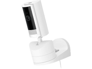 Caméra de sécurité Ring blanche. Elle est montée sur une base blanche avec objectif noir.