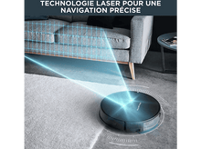 Charger l&#39;image dans la galerie, Aspirateur robot nettoyant une pièce. Lumières laser bleues sur le sol.
