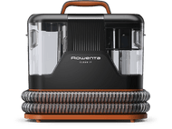 Un nettoyeur de tapis noir et orange avec des réservoirs transparents et une poignée. La marque est Rowenta.