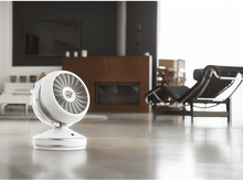 Charger l&#39;image dans la galerie, Un ventilateur blanc sans pales est posé sur un sol dans une maison moderne.
