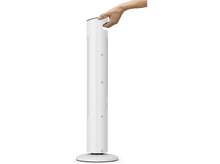 Charger l&#39;image dans la galerie, Une main tient un appareil cylindrique blanc. L&#39;appareil a une base et des évents. Le fond est un dégradé de blanc et de gris.
