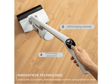 Charger l&#39;image dans la galerie, Un aspirateur sans fil blanc avec un affichage numérique et une main l&#39;utilisant.

