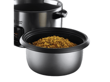 Charger l&#39;image dans la galerie, Un cuiseur de riz avec un bol de riz cuit au premier plan, fond noir.
