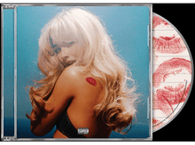 Charger l&#39;image dans la galerie, Pochette d&#39;album avec femme, marque de baiser et texte.
