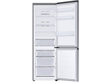 Charger l'image dans la galerie, Réfrigérateur ouvert avec tiroirs et étagères, montrant le contenu.
