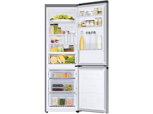 Charger l'image dans la galerie, Réfrigérateur ouvert avec des aliments à l'intérieur, y compris des légumes, des fruits et des bouteilles.
